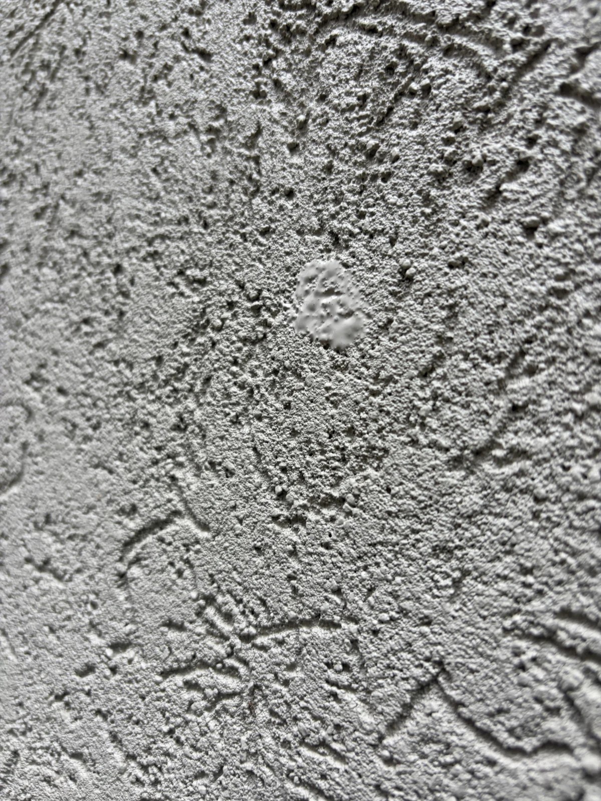 Close-up of a sealed probe location showing the difference in surface texture